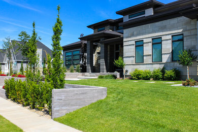 Inspiration for a mid-sized modern gray one-story stone exterior home remodel in Salt Lake City