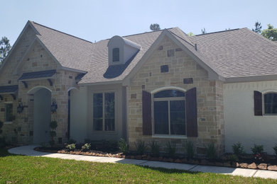 Example of a french country exterior home design in Houston