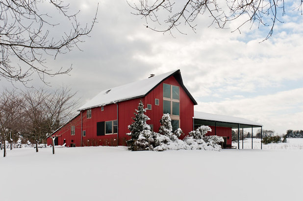 Farmhouse Exterior by Sandvold Blanda Architecture + Interiors LLC