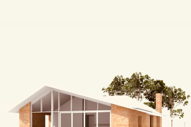 Mittelgroßes, Einstöckiges Retro Einfamilienhaus mit Backsteinfassade, gelber Fassadenfarbe, Walmdach und Ziegeldach in Melbourne