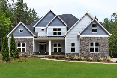 Example of a gray two-story exterior home design in Charlotte