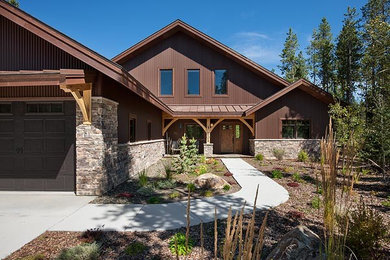 Example of a mid-sized trendy brown two-story metal exterior home design in Denver