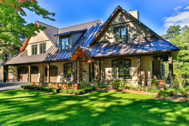 Large transitional beige two-story wood gable roof idea in Toronto