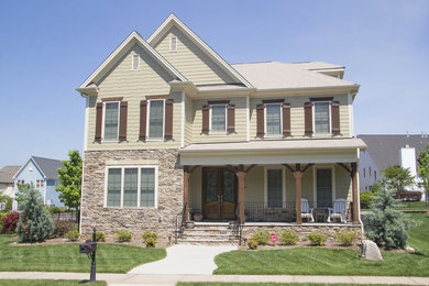 Example of a transitional exterior home design in Raleigh