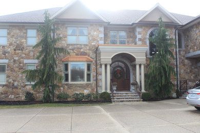 Design ideas for a classic two floor detached house in Providence with stone cladding.