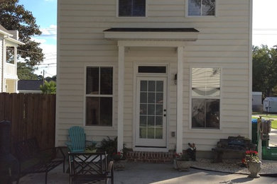 Mid-sized traditional beige one-story vinyl exterior home idea in Charleston