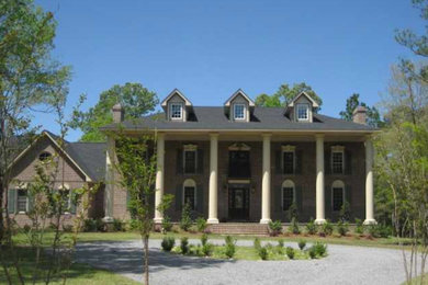 Inspiration for a huge three-story brick exterior home remodel in Charleston