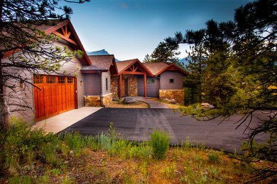 Example of a large arts and crafts gray two-story mixed siding exterior home design in Denver with a shingle roof