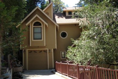 Example of a mid-sized trendy beige three-story wood gable roof design in Los Angeles