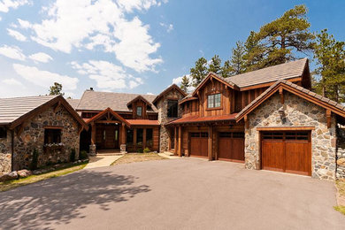 Example of a large mountain style two-story mixed siding exterior home design in Denver with a tile roof