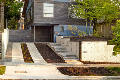 Inspiration for a mid-sized contemporary black three-story mixed siding exterior home remodel in Seattle