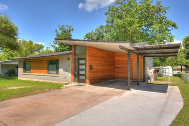 Design ideas for a medium sized contemporary bungalow house exterior in Austin with mixed cladding.