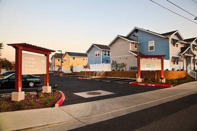Mid-sized contemporary two-story mixed siding exterior home idea in Sacramento