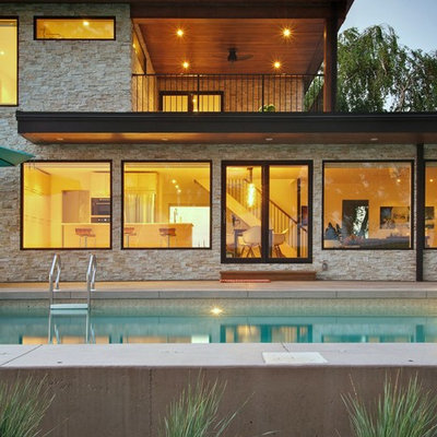 Inspiration for a contemporary two-story stone exterior home remodel in Toronto