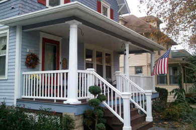 Small transitional blue two-story vinyl exterior home idea in Philadelphia