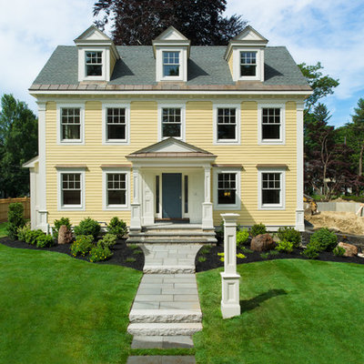 Elegant yellow exterior home photo in Boston