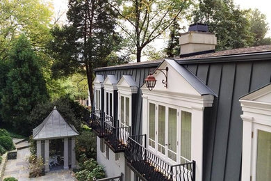 Inspiration for a large timeless gray two-story metal exterior home remodel in DC Metro with a shingle roof