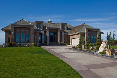 Large contemporary beige one-story stucco exterior home idea in Edmonton