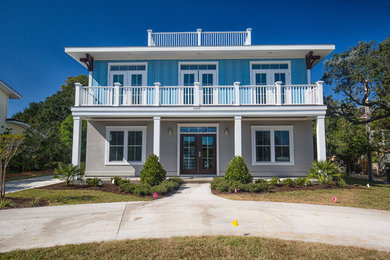 Mid-sized beach style multicolored two-story mixed siding exterior home photo in Other