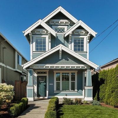 Transitional blue two-story wood exterior home idea in Portland