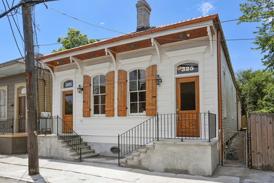 Example of a classic white one-story wood exterior home design in New Orleans