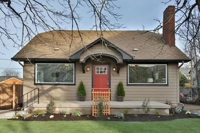 Example of a mid-sized classic beige one-story wood exterior home design in Portland with a shingle roof