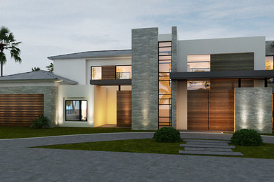 Example of a large minimalist beige two-story stone exterior home design in Austin