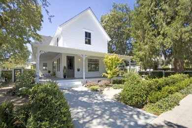 Example of a mid-sized farmhouse white two-story wood exterior home design in San Francisco