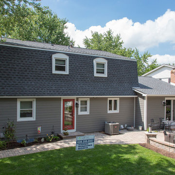 Naperville home with renovated exterior and gambrel roof.