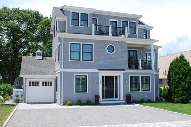 Large coastal gray three-story wood exterior home idea in Providence