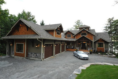 Example of a two-story wood exterior home design in Toronto