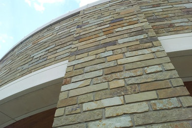 Mountain style stone exterior home photo in Houston