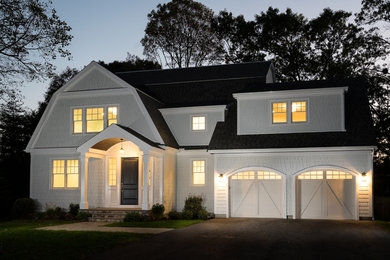 Large traditional white two-story concrete fiberboard house exterior idea in Boston with a gambrel roof and a shingle roof