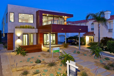 Inspiration for a large contemporary two-story exterior home remodel in San Diego