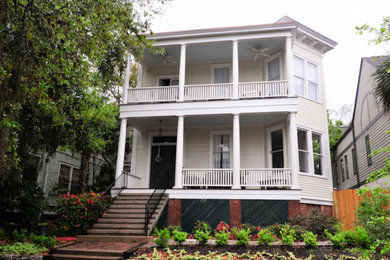 Example of a mid-sized white two-story wood exterior home design in Atlanta