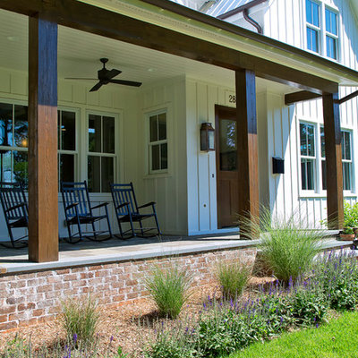 Mid-sized country white two-story concrete fiberboard exterior home photo in Raleigh with a metal roof