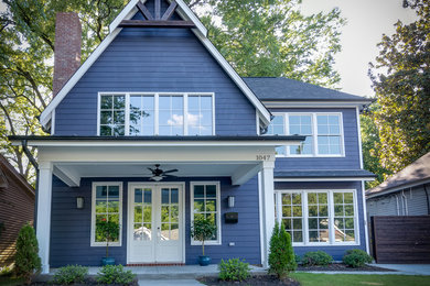 Inspiration for a mid-sized craftsman blue wood exterior home remodel in Other with a shingle roof