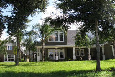 Example of a large classic brown two-story exterior home design in Orlando