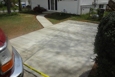 New driveway with a walkway and steps with front stoop rebuild.