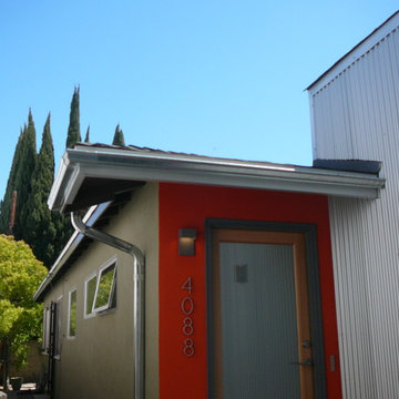 New Galvanized Roof Gutters and Downspout over Entry