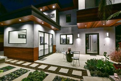 Inspiration for a large contemporary multicolored two-story mixed siding exterior home remodel in San Diego