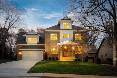 Inspiration for a large timeless brick house exterior remodel in Charlotte
