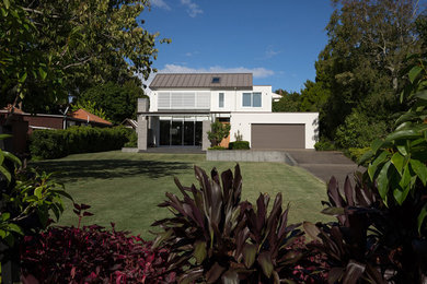 Design ideas for a large and white classic two floor house exterior in Auckland with mixed cladding.