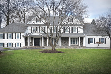 Inspiration for a huge farmhouse white three-story mixed siding gable roof remodel in New York