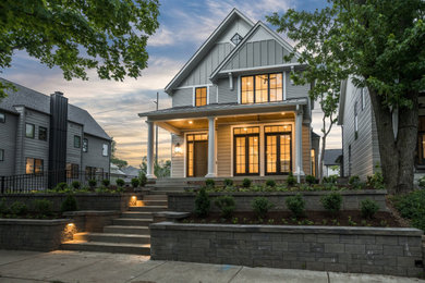 Mid-sized transitional gray three-story concrete fiberboard house exterior idea in Indianapolis with a mixed material roof