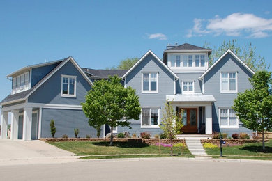 Inspiration for a large and blue classic two floor detached house in Denver with concrete fibreboard cladding, a pitched roof and a shingle roof.