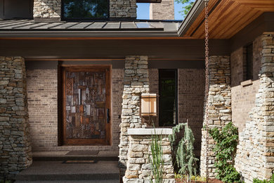 Transitional stone exterior home idea in Cincinnati