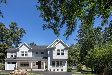 Mid-sized elegant white two-story wood exterior home photo in New York with a shingle roof
