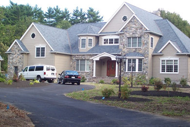 Example of a classic brown two-story exterior home design in Boston