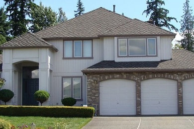 Large transitional beige two-story mixed siding exterior home photo in Seattle with a hip roof
